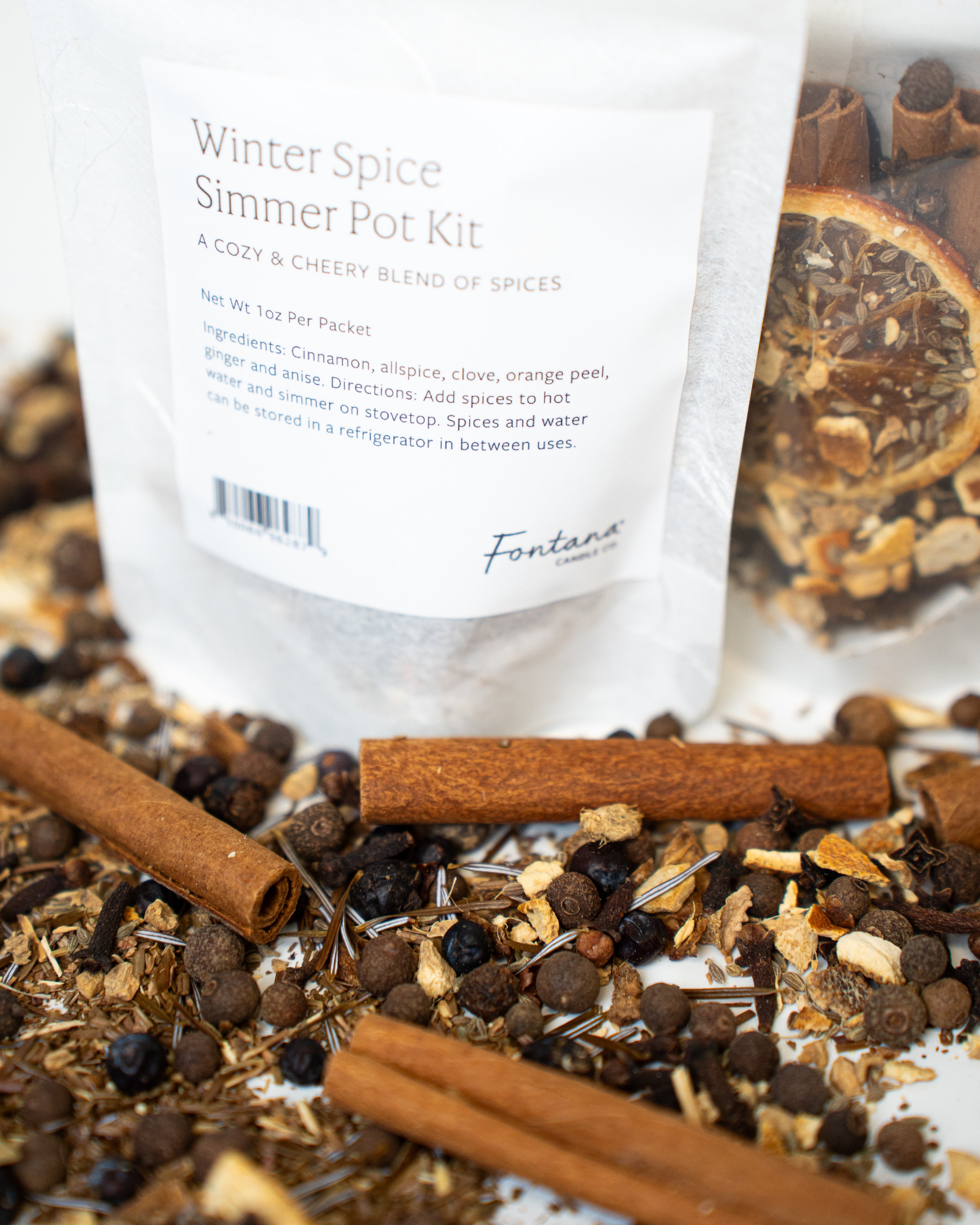 Winter Spice Simmer Pot Kit with cinnamon sticks and other spices on a white background