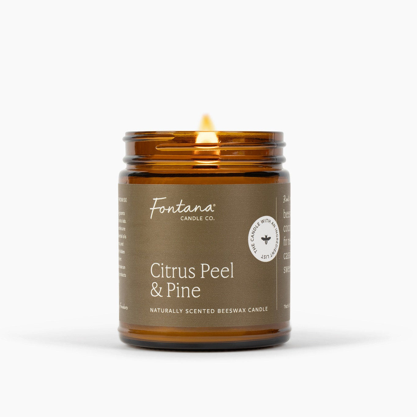 Amber candle jar with 'Fontana Candle Co. Citrus Peel &amp; Pine' label on a white background