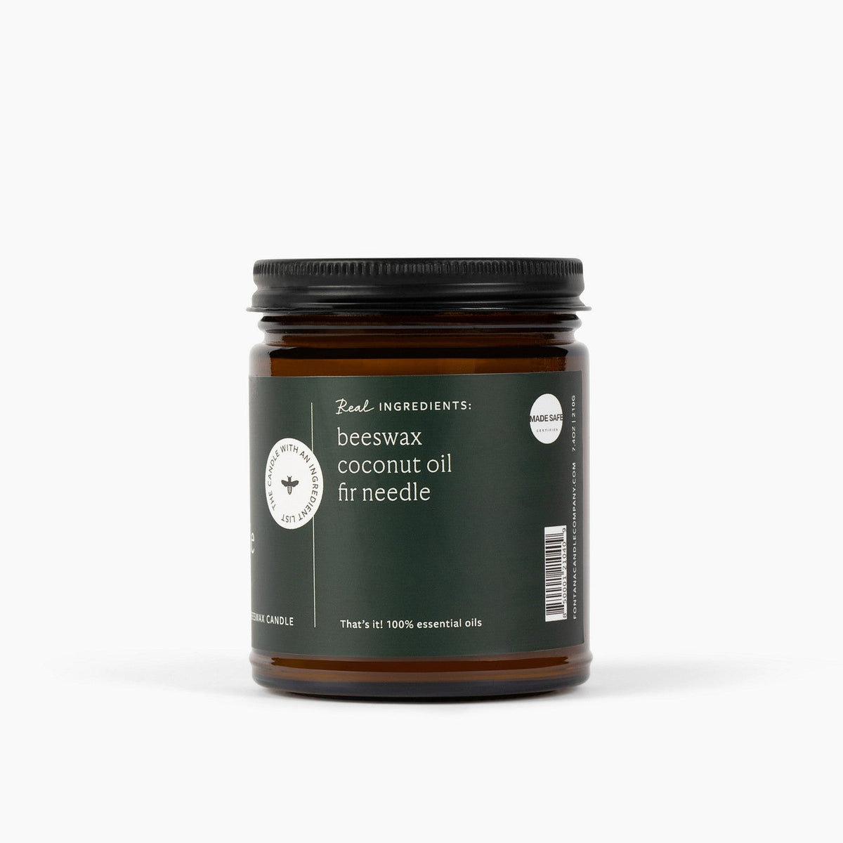Candle jar with an ingredient label on the side listing beeswax, coconut oil and fir needle ingredients on a white background.