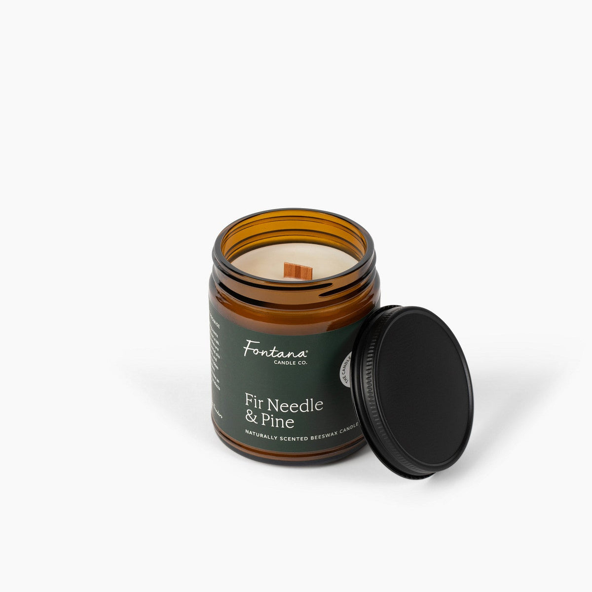 Candle jar labeled 'Fontana Candle Co. Fir Needle &amp; Pine' on a white background