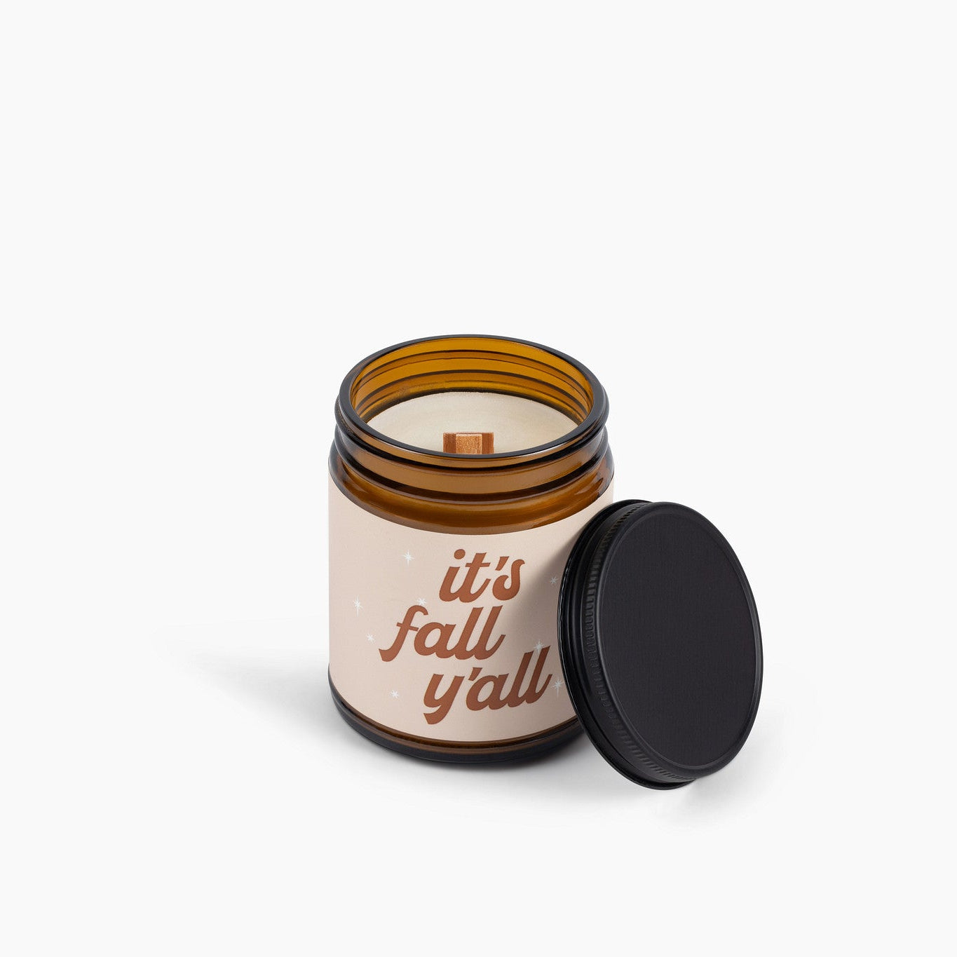 Candle jar with 'it's fall y'all' text on a white background