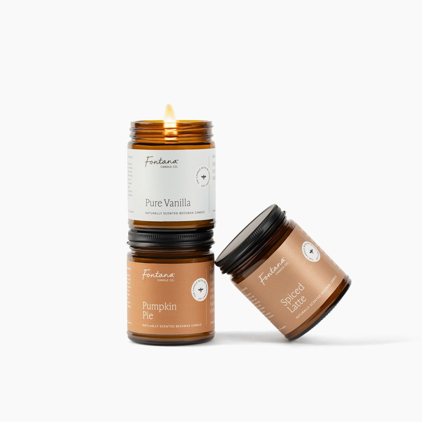 Three scented candles Pumpkin Pie, Pure Vanilla and Spiced Latte with labels on a white background 