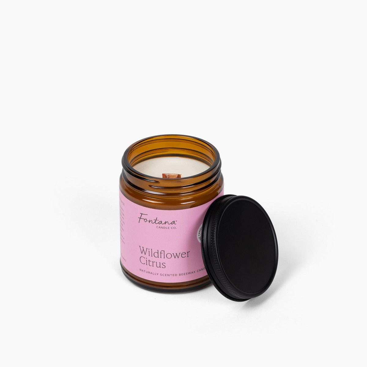 elevated view of the wildflower citrus 9oz jar candle, with the wick visible