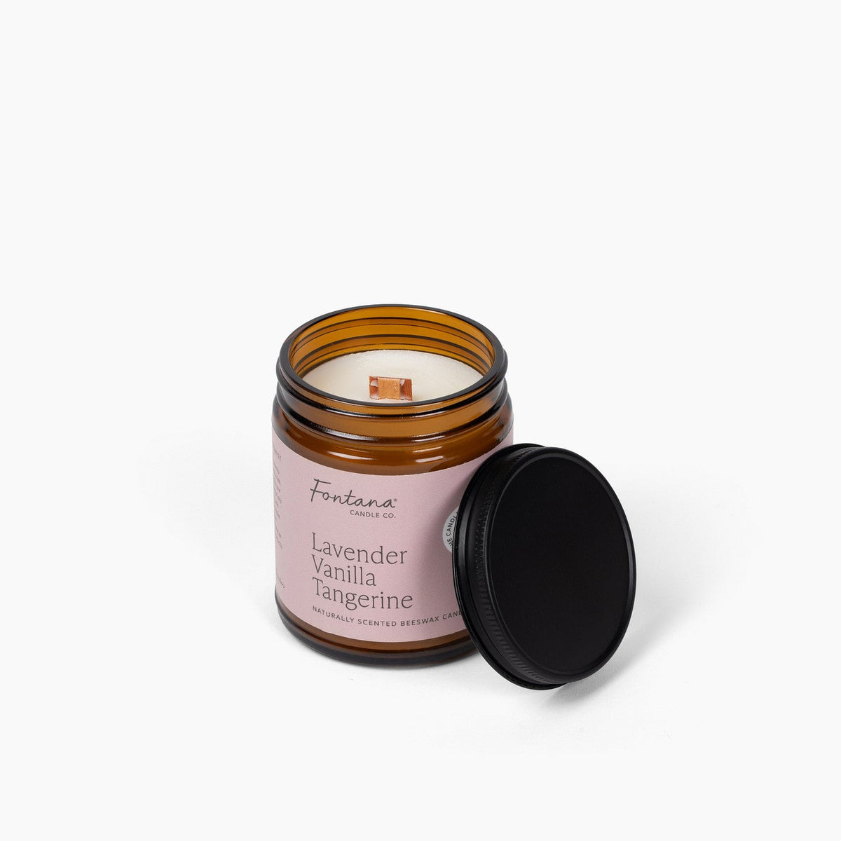 elevated view of the lavender vanilla tangerine 9oz jar candle, with the wick visible