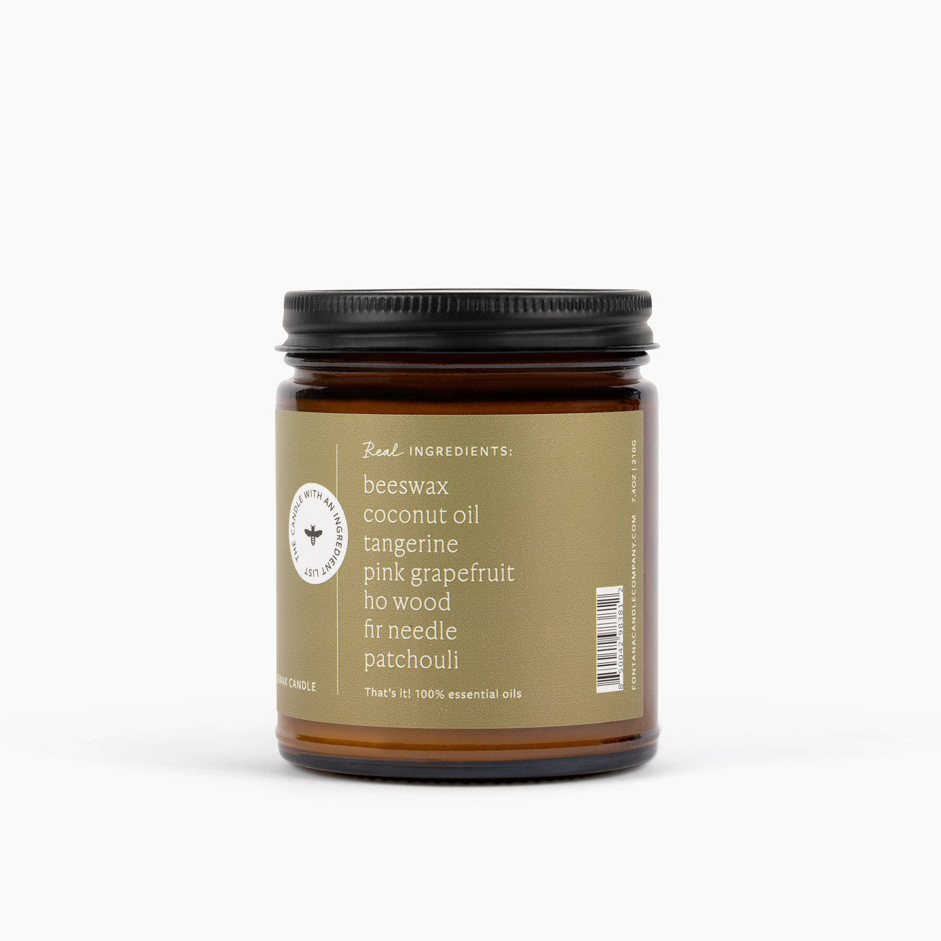 Candle jar with an ingredient label on the side listing beeswax, coconut oil, tangerine, pink grapefruit, ho wood, fir needle and patchouli ingredients on a white background
