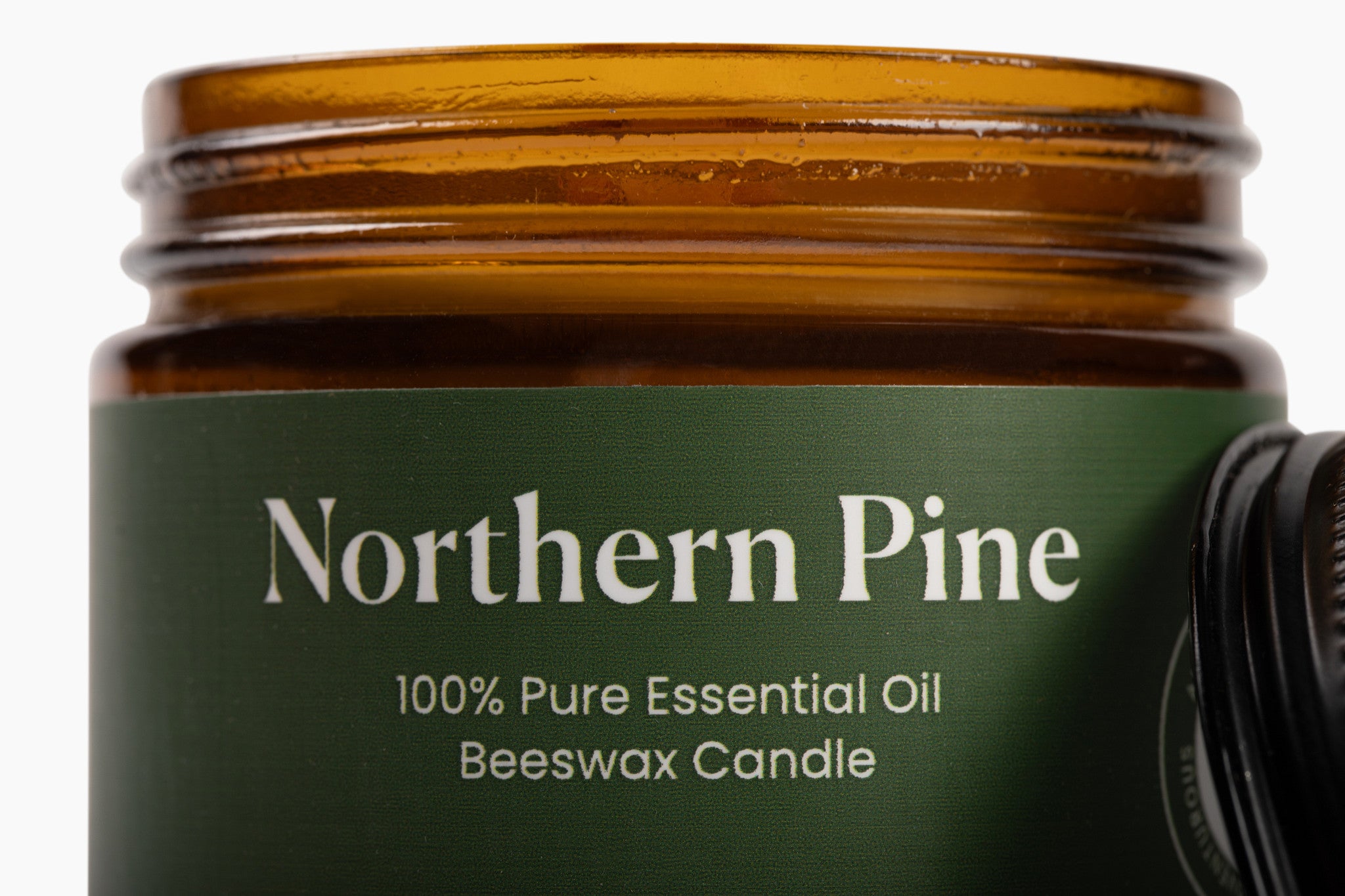 Brown glass jar with green label reading 'Northern Pine' on a white background