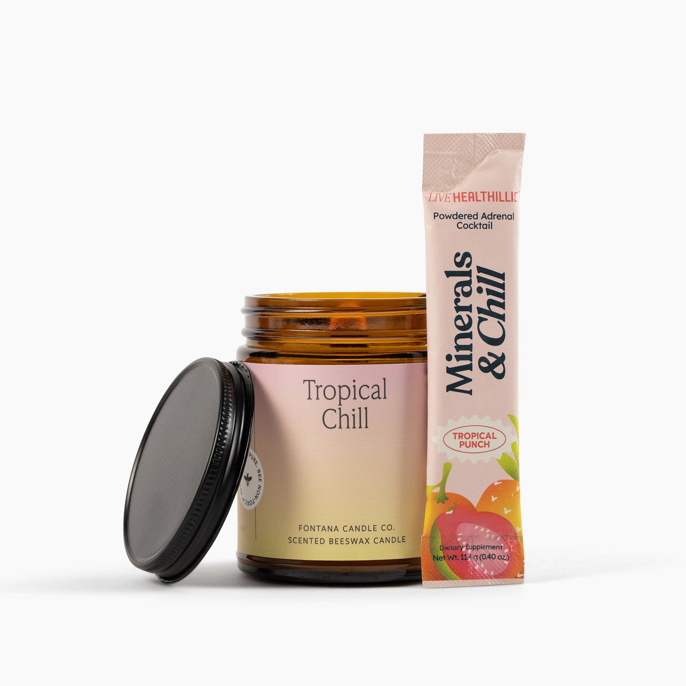 Tropical Chill amber glass jar candle next to Live Healthillie's Minerals and Chill Tropical Punch packet on a white background.