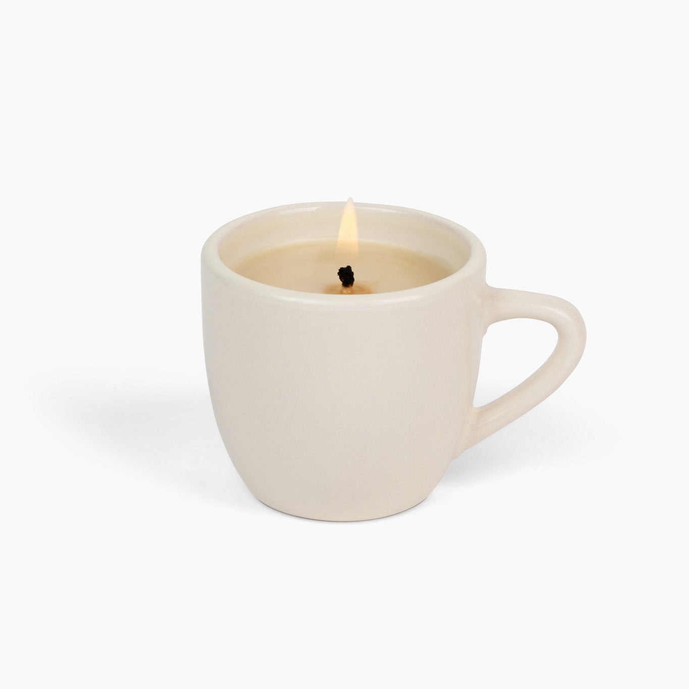 White mug candle on a white background