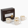 Set of 4 coffee cup-shaped candles with a 'Fontana' branded box on a white background.