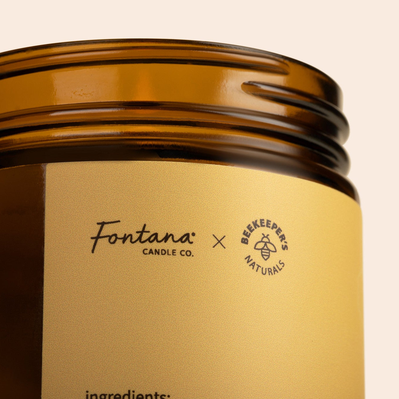 Brown candle jar with 'Fontana Candle Co. x Beekeeper's Natural's' label on a beige background