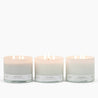 3 Lit 3-Wick candles in white glass vessels: Spiced Latte, Pure Vanilla, and Pumpkin Pie. 