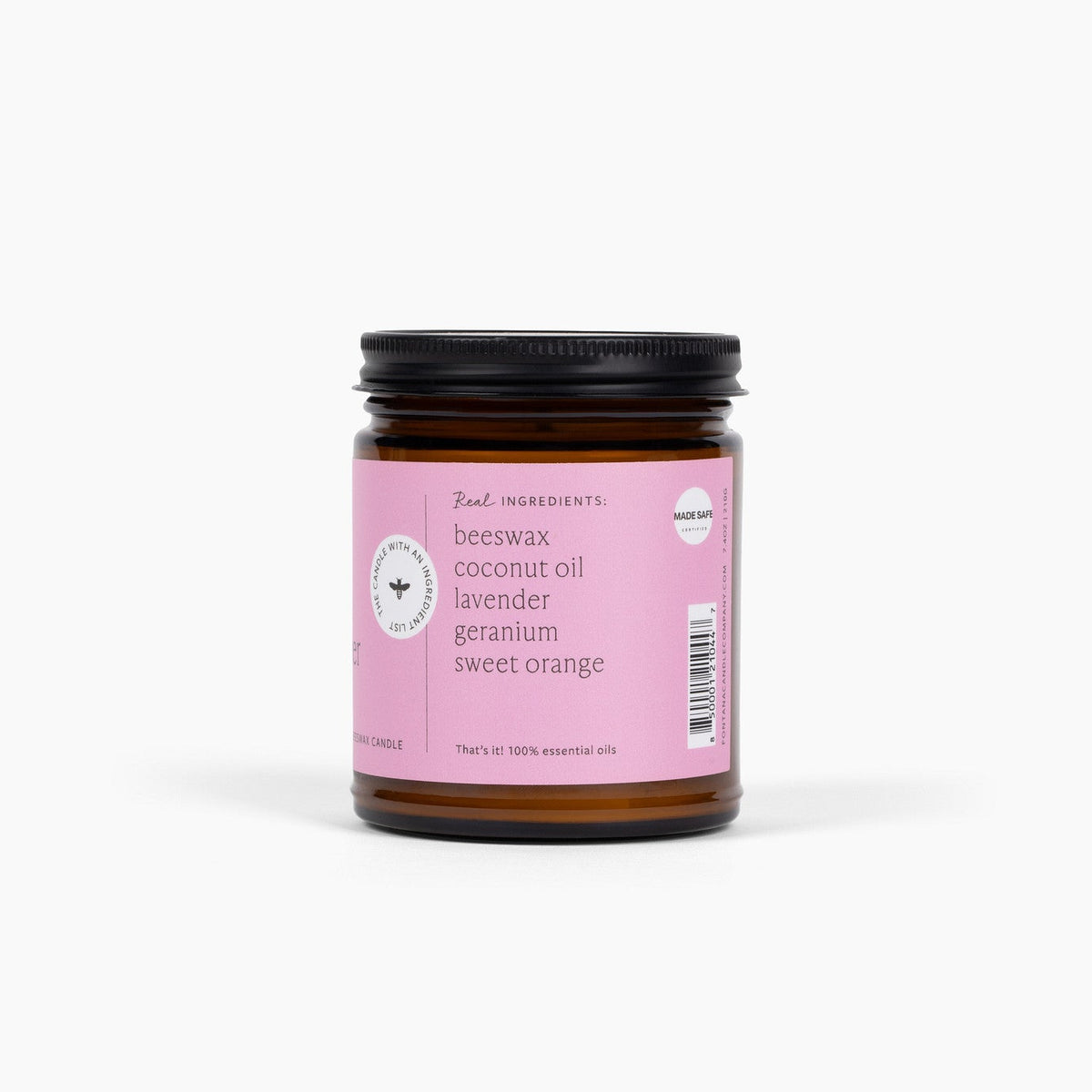 side view of the wildflower citrus 9oz jar candle, showing the ingredients in the candle