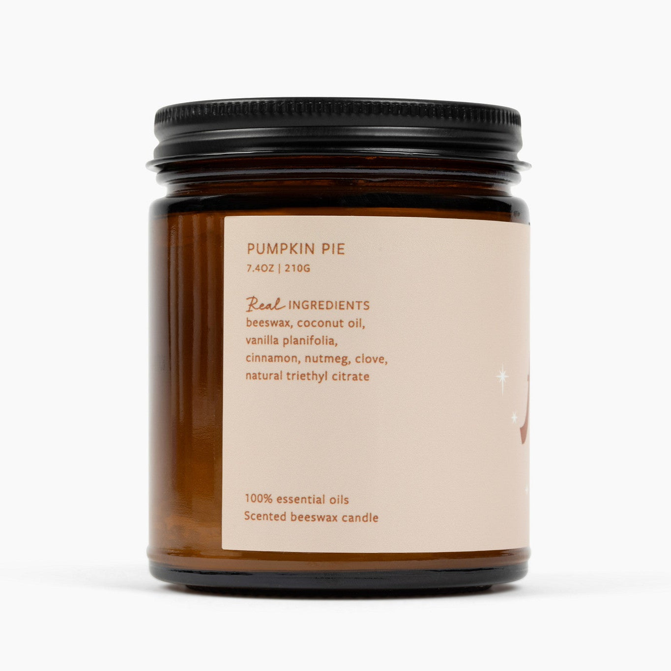 Side shot of amber glass candle that shows the ingredients for the Pumpkin Pie candle scent: beeswax, coconut oil, vanilla planifolia, cinnamon, nutmeg, clove, natural triethyl citrate