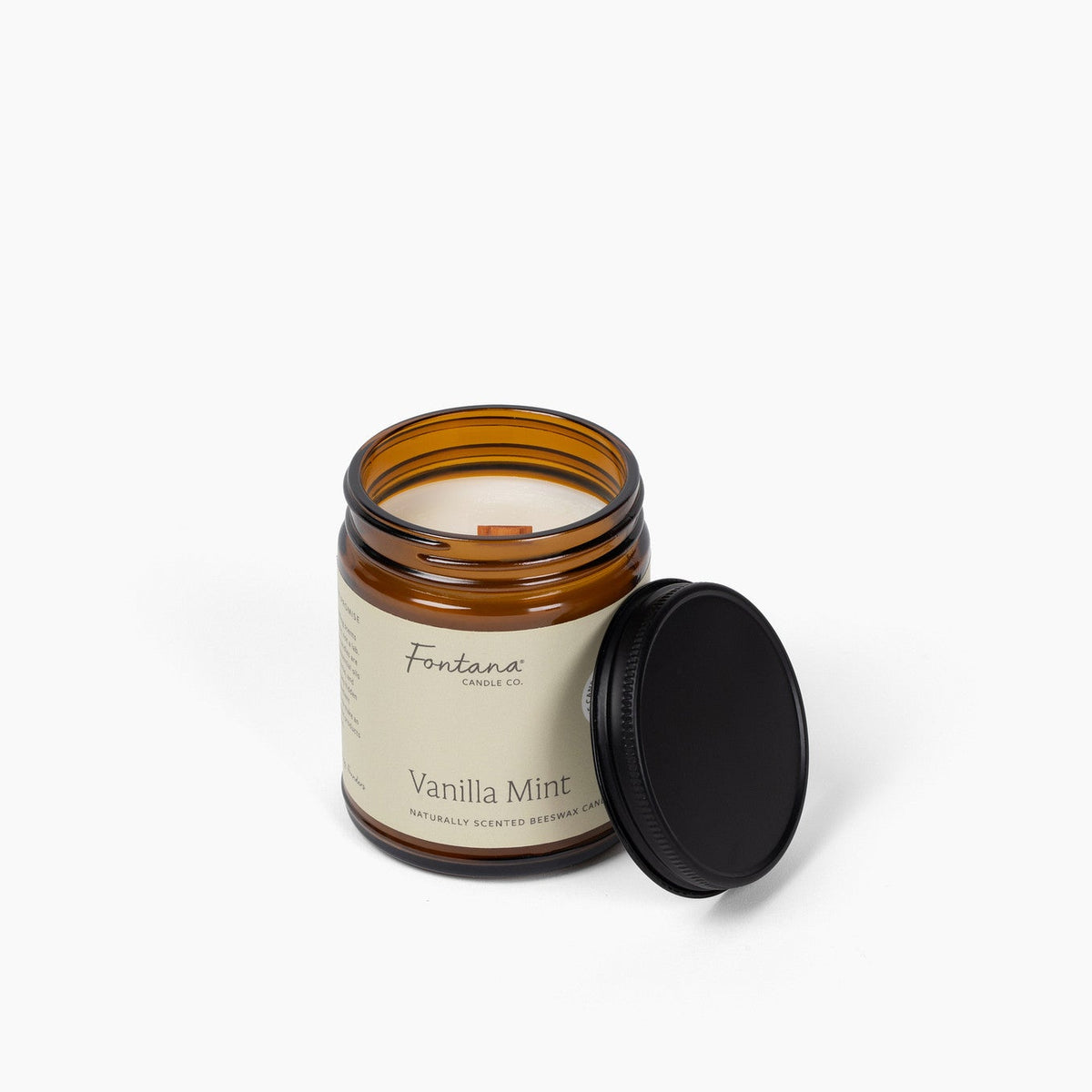 elevated view of the vanilla mint 9oz jar candle, with the wick visible